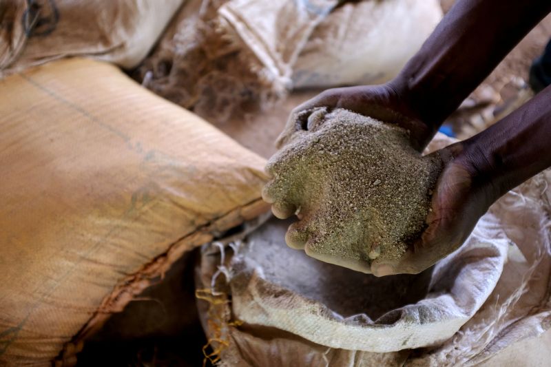 An informal gold miner handles rubble containing gold after it has been crushed by a rock-breaking machine at a site in Bawdie, Ghana, April 4, 2019. REUTERS/Francis Kokoroko