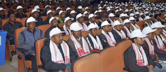 Surrendered militants from eight banned insurgent outfits are seen during the arms laying down ceremony at GMCH auditorium, in Guwahati, Thursday, Jan. 23, 2020. A total of 644 militants of the insurgent groups ULFA (I), NDFB, RNLF, KLO, CPI (Maoist), NSLA, ADF and NLFB surrendered in presence of Assam Chief Minister Sarbananda Sonowal today. (PTI Photo