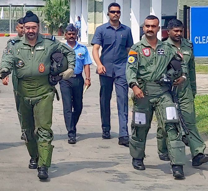 Pathankot: Air Chief Marshal BS Dhanoa and Wing Commander Abhinandan Varthaman, the IAF pilot who became the face of a tense military confrontation between India and Pakistan in February, before a sortie on the MiG 21 jet, at Airforce Station, Pathankot, Monday, Sept 02, 2019. (PTI Photo)(PTI9_2_2019_000047B)