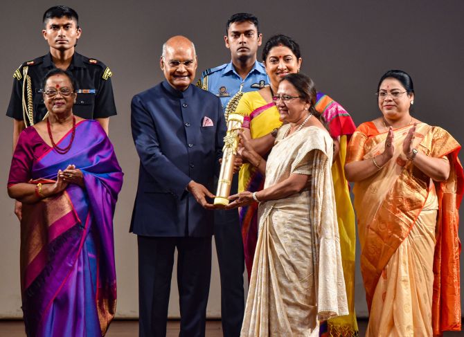 Automotive and R&D professional Rashmi Urdhwardeshe receives 'Nari Shakti Puraskar 2019' on International Women's Day from President Ram Nath Kovind as First Lady Savita Kovind and Union Minister Smriti Irani look on, at Rashtrapati Bhavan Cultural Center in New Delhi, Sunday, March 8, 2020. Since 2014, Urdhwardeshe has been the Director  of the Automotive Research Association of India (ARAI) founded in 1966 by the Indian Automotive Industry with the support from Government of India. (PTI Photo/Manvender Vashist)