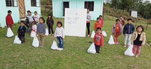 Students receive midday meal at GHS Shoixe under Zunheboto district. 