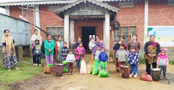 Some of the CHILD LINE 1098 Peren beneficiaries from Tening village with District Administration DBs at Tening Village Council Hall on April 25. 